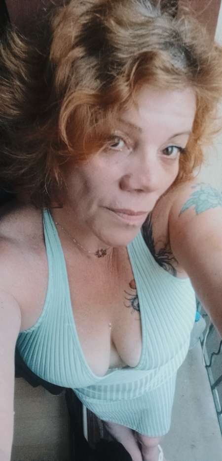 Photo de  Quinqua rousse et pulpeuse